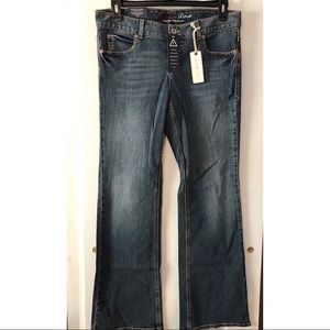 Tommy Hilfiger medium wash boot cut jeans.